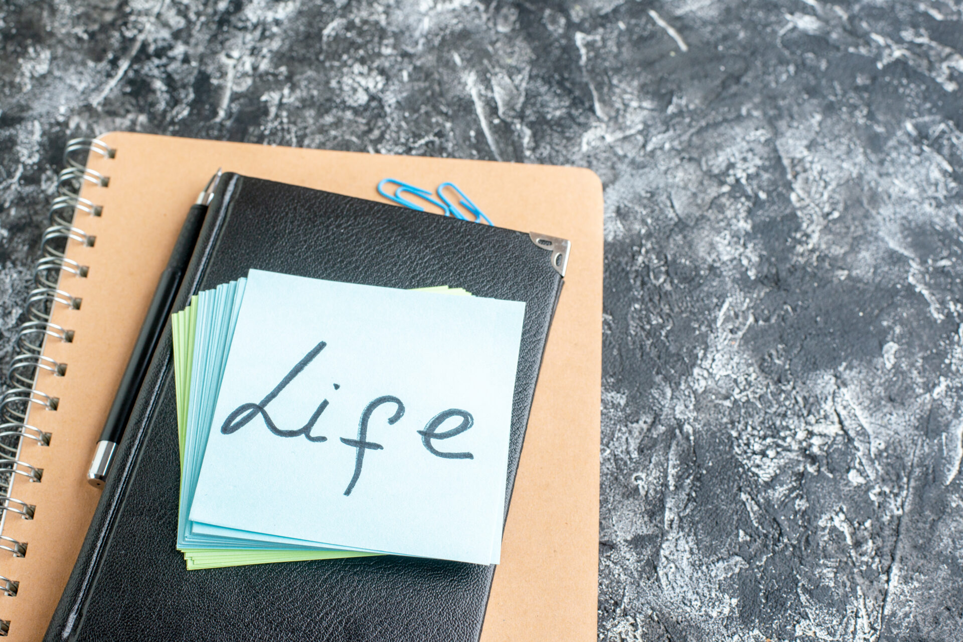 A stack of paper with the word life written on it.